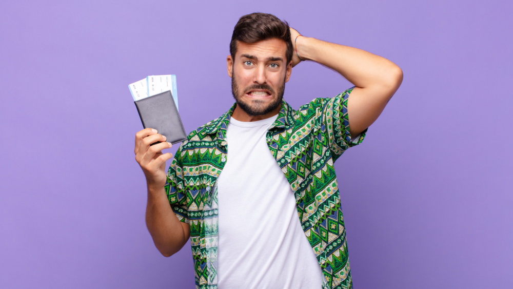 a worried man with tickets